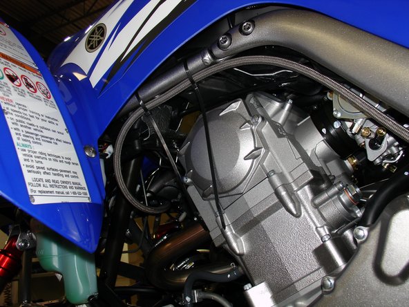 Root the hose along the left side of the frame.