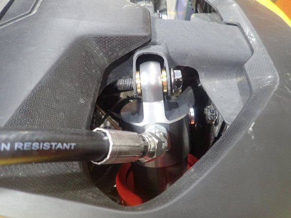 Attach the reservoirs on the roll cage as shown.