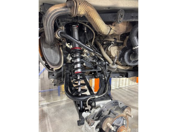 On Stage 2, Stage 4 and Stage 5 models, the lower shock eyelets should be installed with the rebound adjuster oriented towards the back of the vehicle. If needed, you can turn the lower eyelet to orient properly.