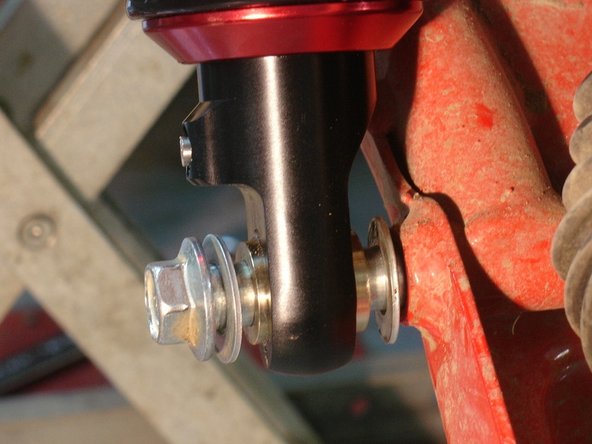 Install lower bolts with the oem washers as shown.