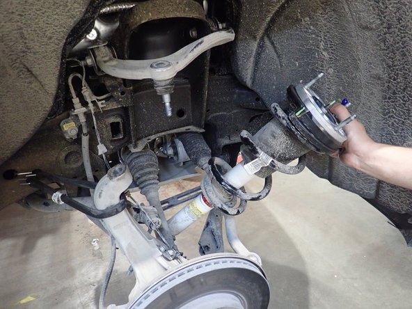 To remove OEM shocks: push the bottom of shocks rearward, lower the shocks to clear frame upper mount, then take out the shocks from above the upper mount.