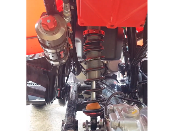 Route the hose as shown and install reservoir on sub-frame as shown with the supplied mounting kit.