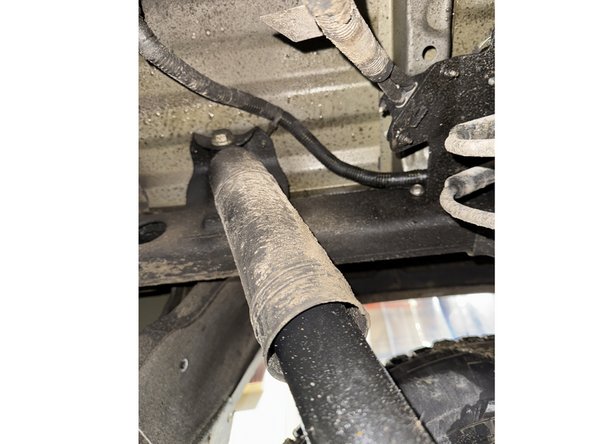 Remove upper and lower bolts from OEM shocks. Keep OEM bolts to install Elka shocks.