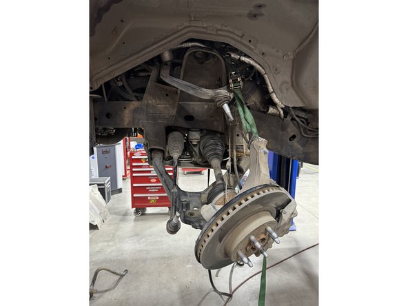 Remove the shock from the vehicle.