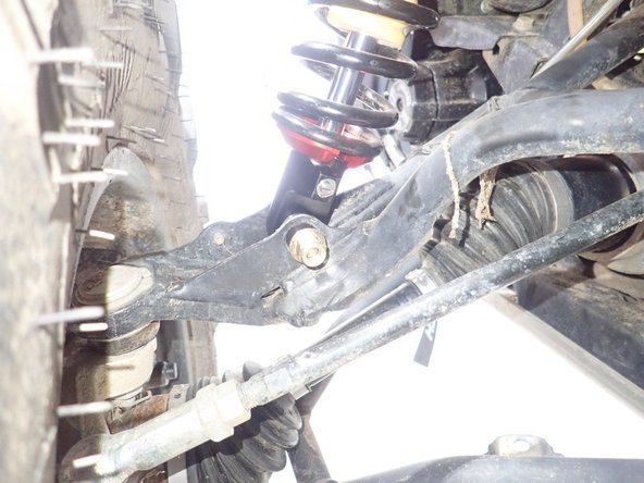 On Stage 2, Stage 4 and Stage 5 models, the lower shock eyelets should be installed with the rebound adjuster oriented towards the rear of the vehicle as shown on the photo ( left side shown ). If needed, you can turn the lower eyelet to orient properly.