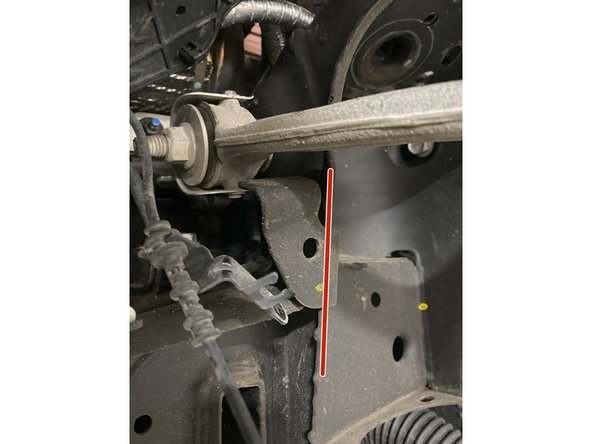 Cut off the upper control arm angle stop bracket on both sides.