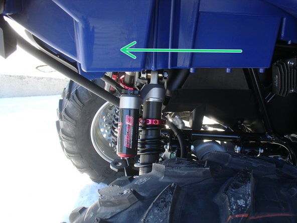 Install both new Elka rear shock with the piggyback reservoir at the top and oriented towards the rear of the vehicle as indicated by the green Arrow on the photo. (right side shown)
