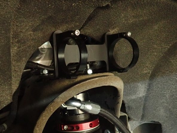 Install washer and nut on studs and torque them at 35 ft.lb.