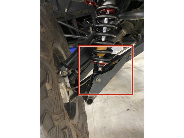On Stage 2, Stage 4, and Stage 5 models the rebound adjuster located on lower eyelet of the shocks should be oriented towards the rear of the vehicle, as shown. (Shown by the red square ). If needed, you can turn the lower eyelet to orient properly.