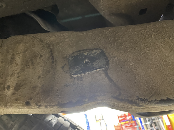 Slide bolt into  the frame hole as shown and fix the bracket with the small bracket that came with the kit on the other side of the frame hole.