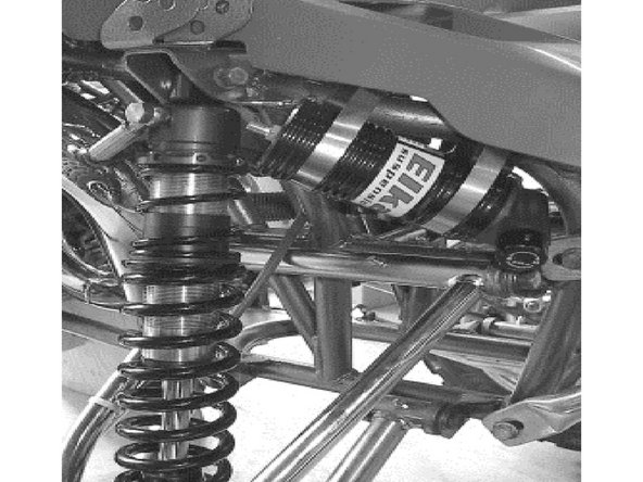 The banjo bolts must be oriented towards the sides of the vehicle with the hose coming out towards the rear. The reservoirs must be attached to the front of the frame using the provided rubber holders and metal collars. Make sure to route the hoses according to photos.