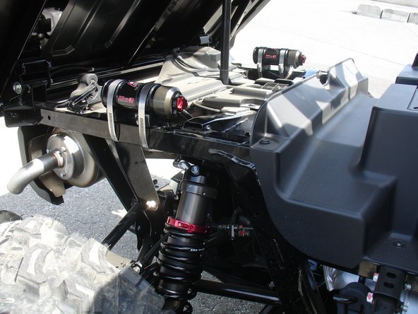 For Pioneer and Pioneer EPS without the seats in the bed, The reservoirs can by mounted over the frame as shown to allow a better access to compression knobs.