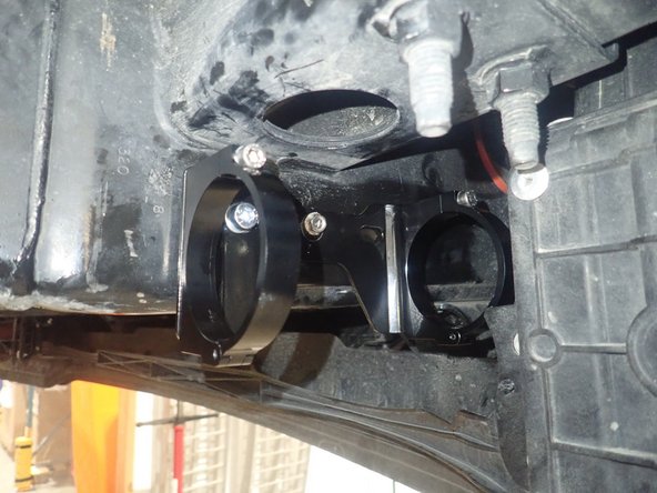 Orienting the bracket assembly as horizontally as possible, use the supplied self-taping screw to secure the bracket in the center bracket hole.