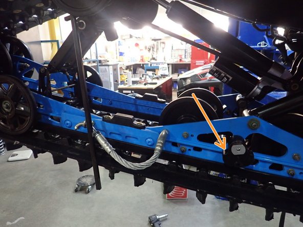 Unload both torsion spring by removing the gold pin shown on the picture.