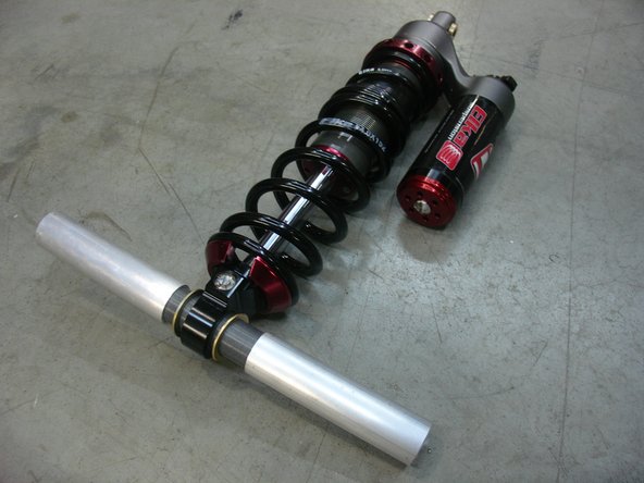 Install OEM lower shaft, washers and sleeves on the Elka lower eyelet.