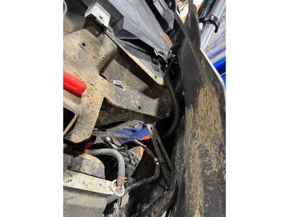 Attach the reservoirs on the roll cage as shown.