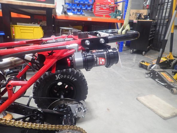 Install rear bracket on the grab bar with supplied bolts.