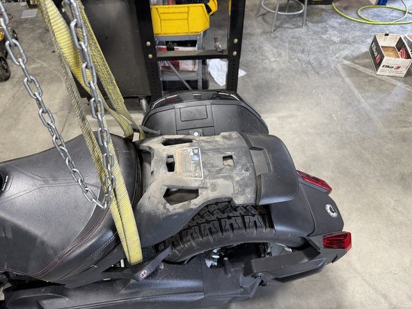 Remove the rear seat.