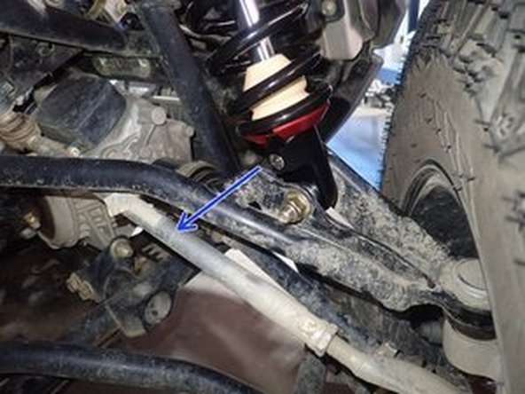 On Stage 2, Stage 4 and Stage 5 models, the lower shock eyelets should be installed with the rebound adjuster oriented towards the rear of the vehicle as shown by the blue Arrow on the photo ( Right side shown ). If needed, you can turn the lower eyelet to orient properly.