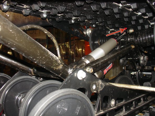 Install the eyelet mount in is place with the rebound facint upward.