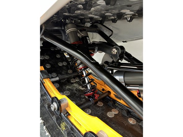 Liberally greasing the bushing area and including the two washers supplied with the Elka shock absorber.