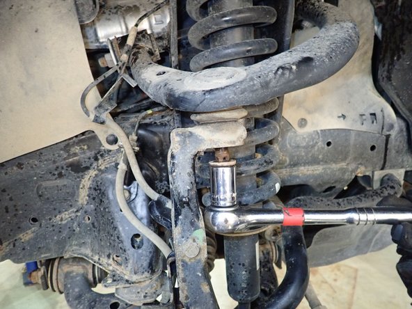 Remove upper arm ball joint nut and separate it from steering knuckle.