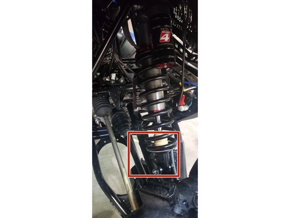 On Stage 2, Stage 4 and Stage 5 models, the lower shock eyelets should be installed with the rebound adjuster oriented towards the back of the vehicle as shown by the red square on the photo ( Right side shown ). If needed, you can turn the lower eyelet to orient properly.