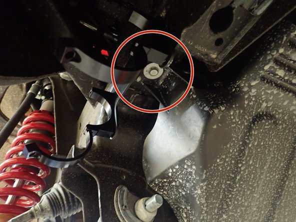 For installation of reservoir brackets, locate the bolt that hold the front plastic protector as shown by red circle. (Right side shown)