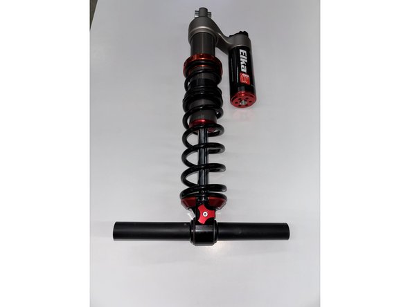 Remove the shaft assembly from the bottom of the OEM centre shock.