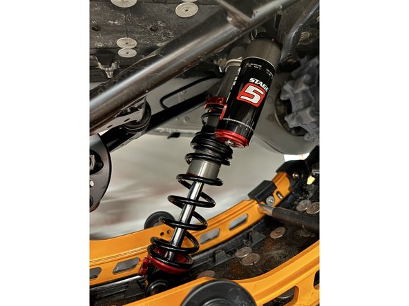 Reinstall the lower shaft on the center Elka shock in the reverse order it was remove.