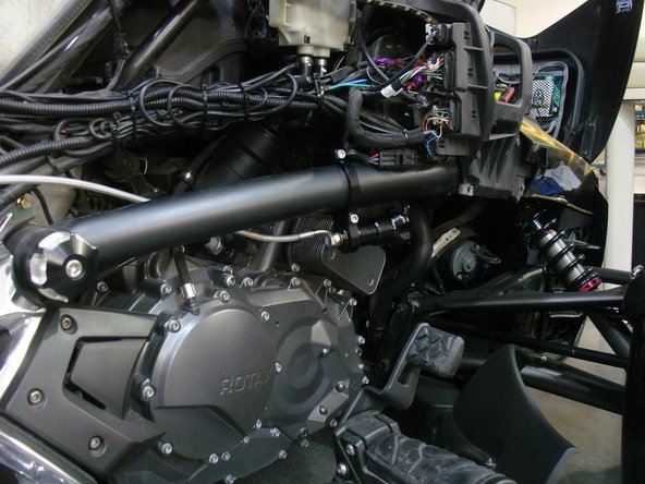 For hydraulic preload adjuster with a Stage 2 shock, fix bracket directly on frame as shown and torque the 2 bolts at 10 ft/pnds