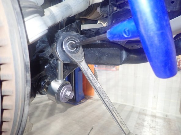 Before reinstalling the sway-bar links, slide both supplied spacers as shown by green circles to offset links and avoid risk of binding on each side of vehicle.
