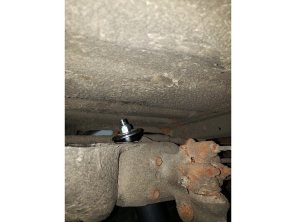 Apply supplied grease on both upper rubber bushings of Elka shocks. Keep lower washer and lower bushing on stud and keep the other ones to install on top of the frame later.