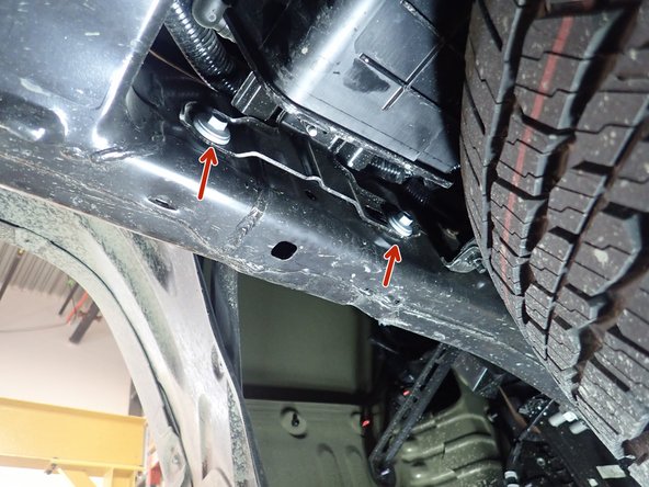 Remove the plastic caps close to the rear fender outside and inside frame.