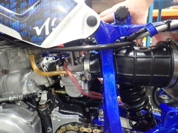 Install the shock with the hose banjo facing the rear of atv.