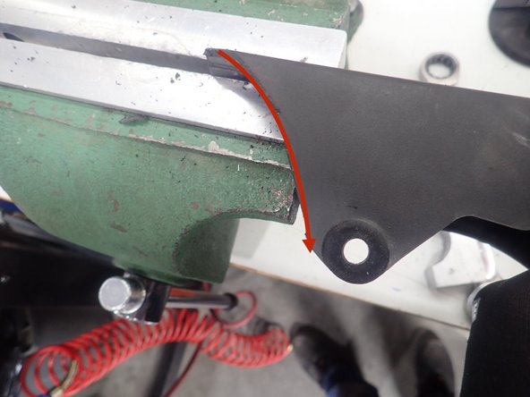 To avoid contact with the spring, trim chain guard as shown.