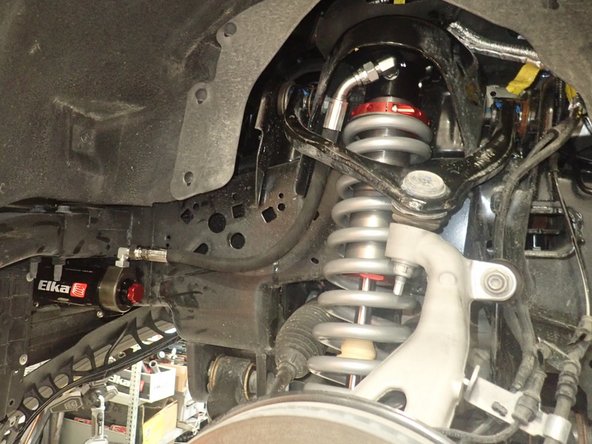 Reassemble the tie rod end, then torque the nut to 70 Ft-Lb.