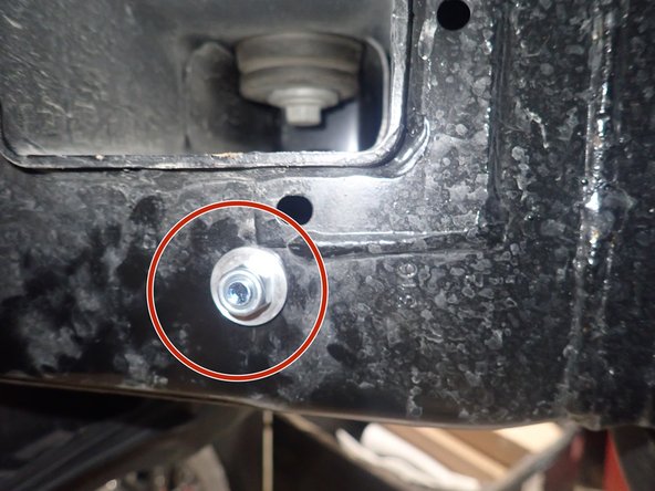 Slide bolt into  frame hole as shown and fix the bracket with the larger washer and supplied nut. Torque nut to 20 Ft-Lb.