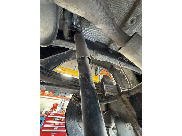 Remove upper and lower bolts from OEM shocks. Keep OEM bolts to install Elka shocks.