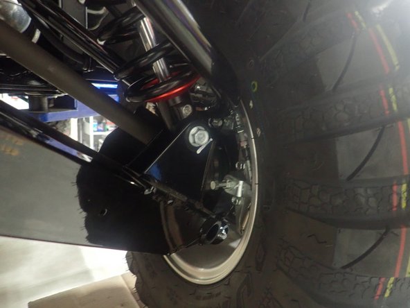 On Stage 2-4-5 models, the lower shock eyelets should be installed with the rebound adjuster oriented towards the rear of the vehicle as shown. If needed, you can turn the lower eyelet to orient properly.