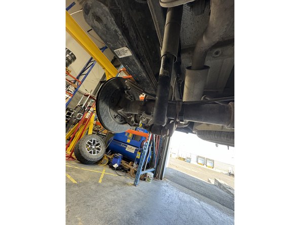 Remove upper and lower bolts from OEM shocks. Keep OEM bolts to install Elka shocks.