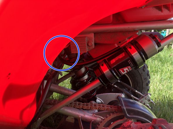On Stage 2, Stage 4, and Stage 5 models the rebound adjuster located on lower eyelet of the shocks should be oriented towards the rear of the vehicle(Yellow Arrow), as shown.If needed, you can turn the lower eyelet to orient properly.