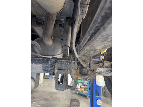 Remove upper and lower bolts from OEM shocks. Keep OEM bolts to install Elka shocks.