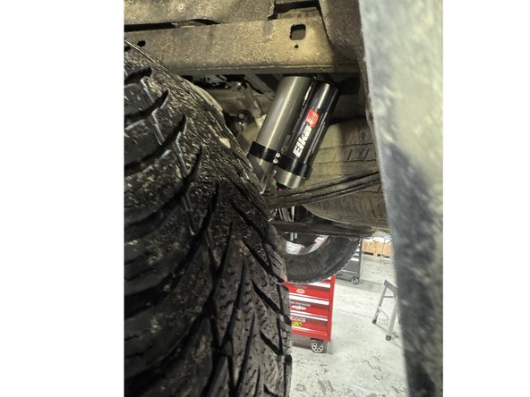 The shock with the offset spacer goes to the left side.