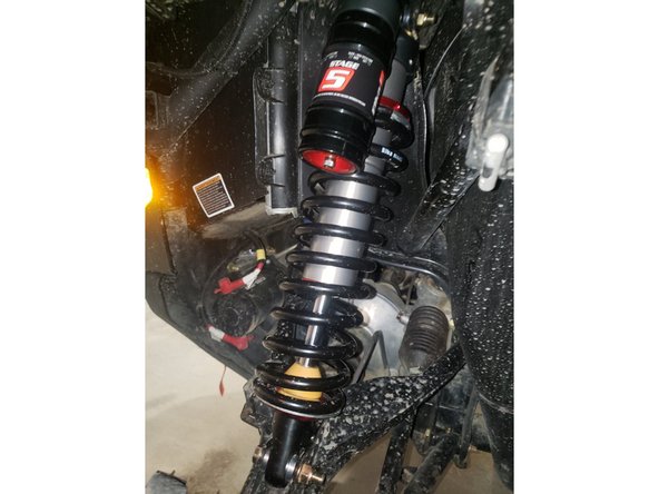 Install the front new Elka shocks with the reservoir ( on Stage 3-4-5 ) or Schraeder nitrogen valve ( on Stage 1-2 ) at the top of vehicle. ( left side shown ). The reservoir must be orientated outwards.