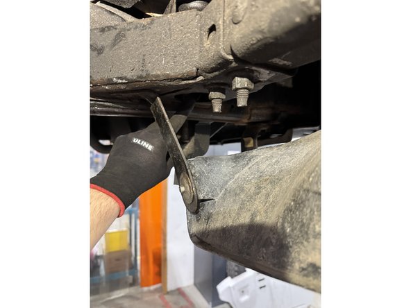 Remove the bolt that hold the front cab support, on both sides.