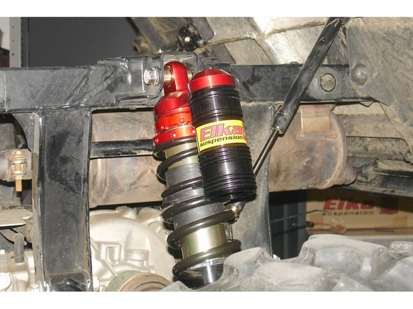 Install the Elka shock absorbers bolting the top mount first with the piggyback reservoirs towards the outside of the vehicule.