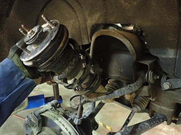 ON DENALI AND ESCALADE MODELS (With Magneride system): Before removing shocks, you have to disconnect electric connectors (showed by red Arrow) situated on top of shocks.