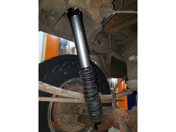 Install lower mount first with OEM bolts.