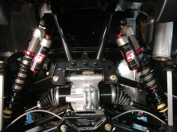 Install the new Elka rear shocks with the piggyback reservoir at the top and oriented towards the rear of the vehicle and pointed slightly Inside the vehicle.